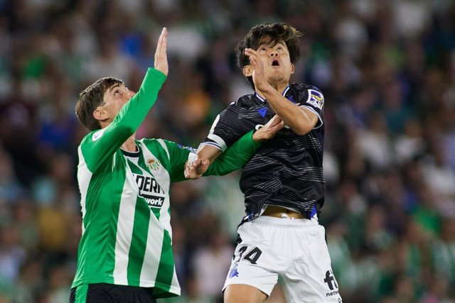Takefusa Kubo of Real Sociedad and Juan Miranda of Real Betis in action during the spanish league, La Liga Santander, football match played between Real Betis and Real Sociedad at Benito Villamarin stadium on April 25, 2023, in Sevilla, Spain.
