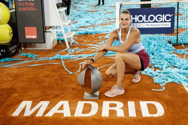 Aryna Sabalenka of Belarus celebrates with the trophy after winning against Iga Swiatek of Poland during the Singles Final Women match during Mutua Madrid Open 2023 celebrated at Caja Magica on May 06, 2023 in Madrid, Spain.