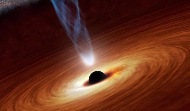 Un agujero negro supermasivo emite un chorro de partículas energéticas en esta ilustración.