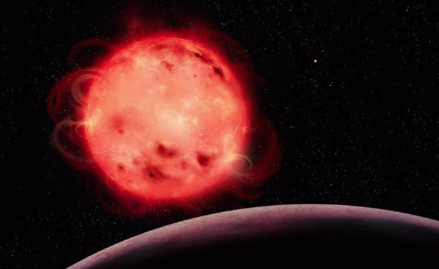 Esta representación artística de la estrella enana roja TRAPPIST-1 muestra su naturaleza muy activa.