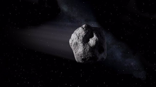 Archivo - Esta ilustración muestra un asteroide cercano a la Tierra como el asteroide 2020 SW viajando a través del espacio