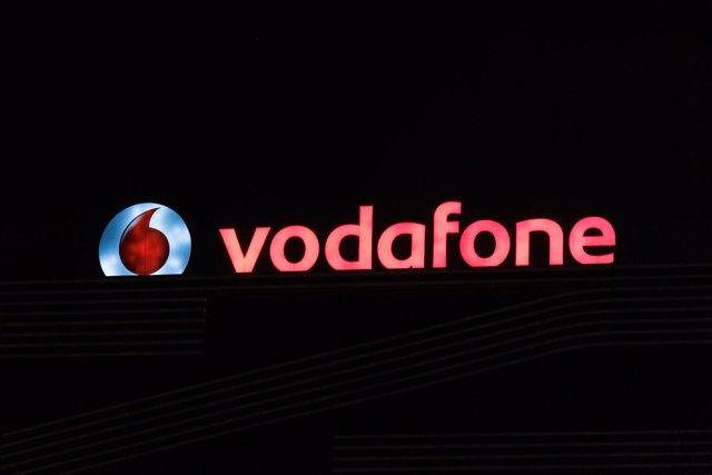 Archivo - Logo de la empresa de Vodafone encendido, a 10 de agosto de 2022, en Madrid (España). 