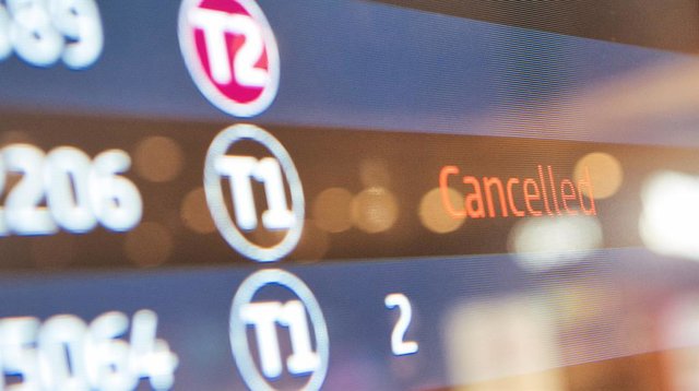 07 February 2024, Berlin: The words "canceled" can be seen on a display board at Berlin Brandenburg Airport. 