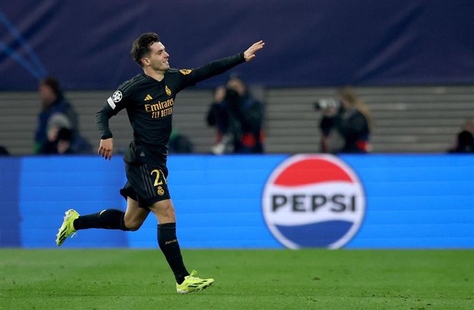 13 February 2024, Saxony, Leipzig: Real Madrid's Brahim Diaz celebrates scoring his side's first goal during the UEFA Champions League round of 16 first leg soccer match between RB Leipzig and Real Madrid at the Red Bull Arena. Photo: Jan Woitas/dpa